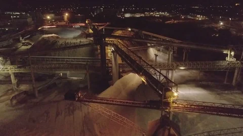 Overview of a mega working conveyor belt at night at the paper factory, 4K Stock Footage 73042639