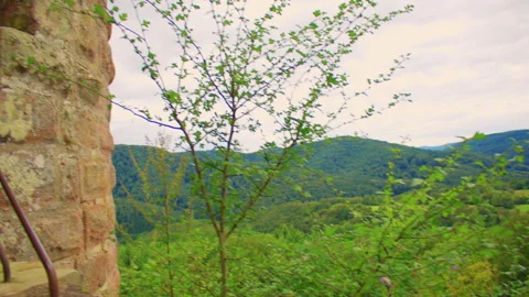 Overview of old weathered stone walls of a castle on a hill Stock Footage 309358346