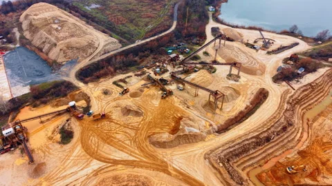 Overview of sand quarry processing plant near lake Stock Footage 333478398