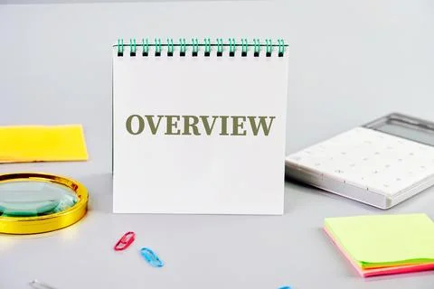 OVERVIEW text in a notebook next to a magnifying glass, calculator, sticker.. Stock Photos