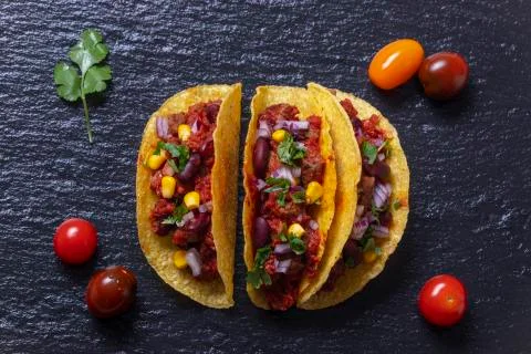 Overview of three tacos on slate Stock Photos
