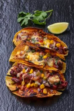 Overview of three tacos on slate Stock Photos