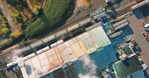 Overview of a transportation hub with train tracks and loading facilities in a Stock Footage 295868486