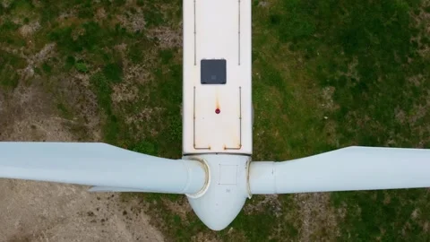 An Overview of a Wind Turbine's Rotating Blades - Aerial Topdown Shot Stock Footage 283654665