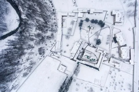 Overview of a winter landscape with a monastery courtyard Stock Photos
