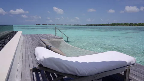Overwater Deck and Turquoise Lagoon at Gili Lankanfushi Maldives Stock Footage 341260692