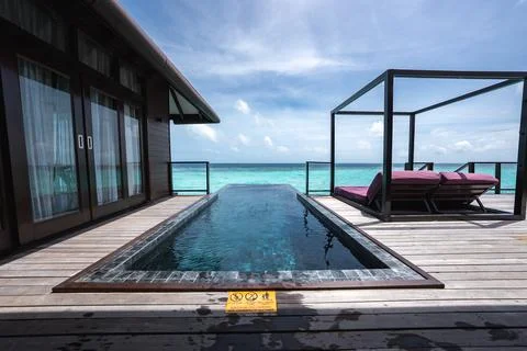 Overwater villa deck with infinity plunge pool in the Maldives Stock Photos