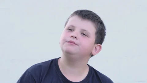 Overweight boy eats potato chips, close-up on the street. Unhealthy food Stock Footage 197571449