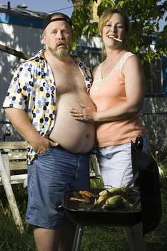 Overweight couple in a trailer park Stock Photos