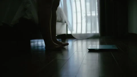Overweight Female Standing on Floor Scale After Getting Out of Bed Stock Footage 329933506