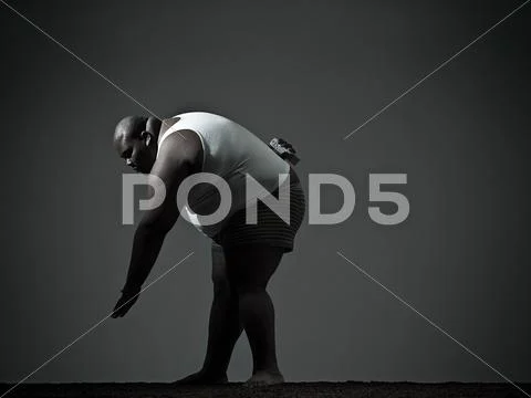 Overweight Man Bending Over