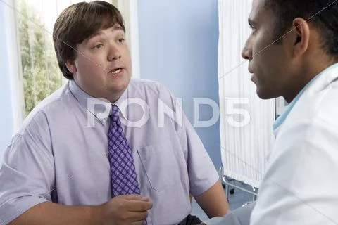 Overweight Man Consulting His Doctor