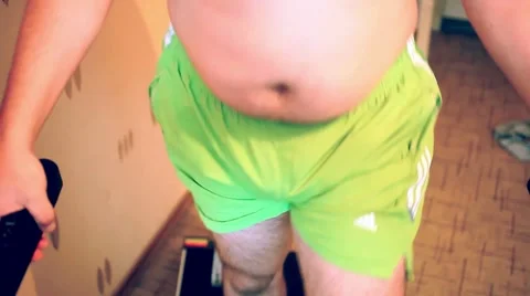 Overweight man on the treadmill Stock Footage 52997507