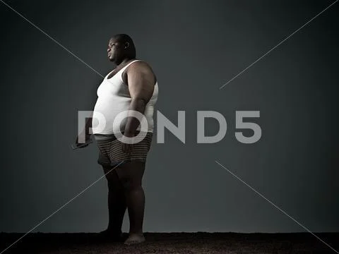 Overweight Man In Underwear Watching Tv