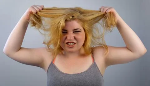Overwhelmed hair pulling Stock Photos
