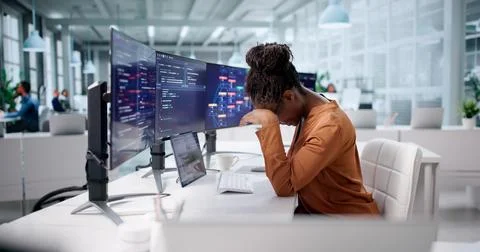 Overwhelmed Software Engineer Staring At Broken Computer Screen In Office 写真素材