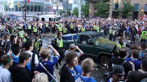 Overwhelming amount of people in riots for too few police officers in Canada Stock Footage 127202240