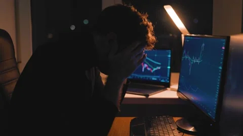 Overworked and Under rested This studio shot of a male trader Video stock 232412173