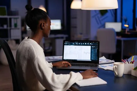 Overworked architect analyzing blueprint engineering project plan Stock Photos