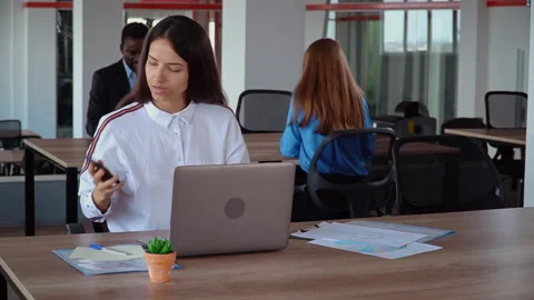 Overworked businesswoman using mobile at work Stock Footage 142720065