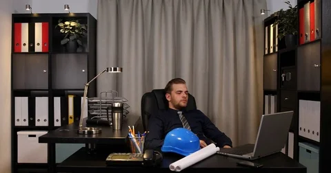 Overworked Constructor Engineer Man Exhausted Sleeping on the Desk Not Work Day Stock Footage