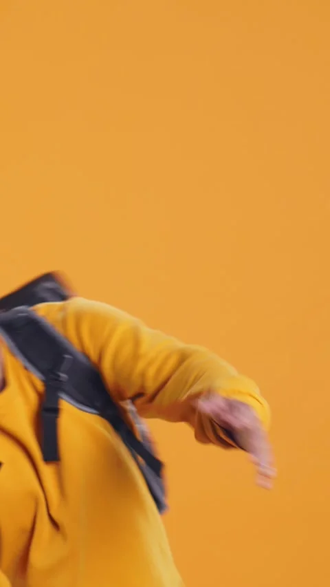 Overworked courier carrying huge stack of pizza boxes, studio background Video stock 274315711