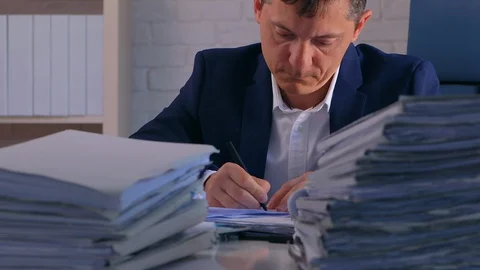 Overworked Exhausted Prosecutor Preparing His Statement for the Lawsuit. 库存影片 129523843