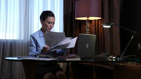 Overworked female throwing papers at workplace Stock Footage 151902219