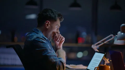 Overworked late worker yawning texting computer indoors closeup. Overtime job Stock Footage 339297922