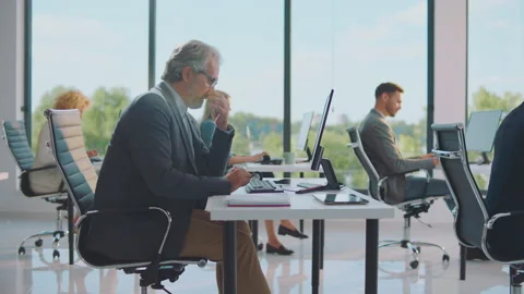 Overworked man collapsed on office desk Stock Footage 164584193