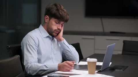 Overworked Man at Desk in the Office Stock Footage 254440437