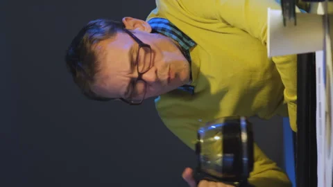 Overworked man drinking coffee at night Stock Footage 253428867