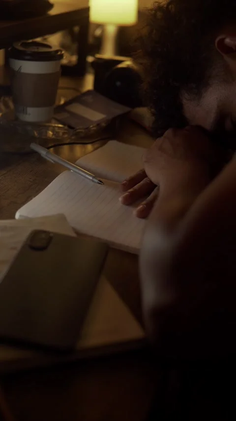 Overworked man feeling stressed while working late at night Stock Footage 327306124