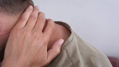 Overworked man with neck pain. Stock Footage 231644032