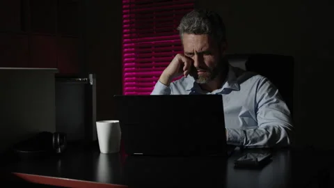 Overworked man working late in the office. Concept of stress and deadline. Man Stock Footage 346703548