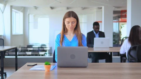 Overworked manager feel migraine in open space office worker in start up company Stock Footage 127865338
