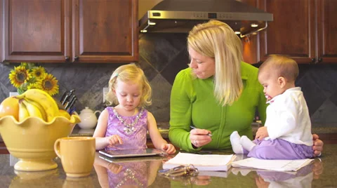 An overworked mother tries to balance work like with her personal life Stock Footage 34003277