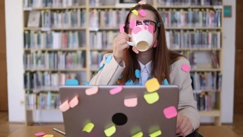 Overworked office employee drinks coffee for energy to handle endless tasks Stock Footage 342178432