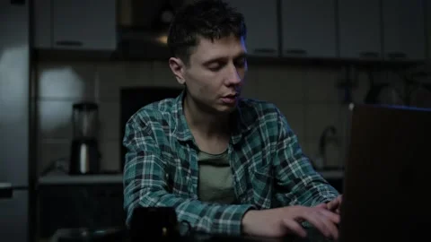 Overworked office worker brings work home, falls asleep late at night at the des Video stock 296980527