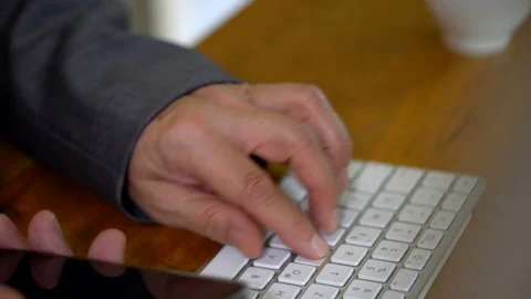 Overworked Old Businessman Calling on Two Phones in Office Stock Footage 112600657