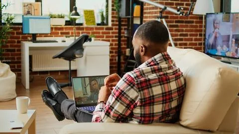 Overworked teleworker in video call Stock Photos