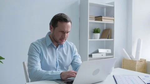 Overworked young man feeling physical discomfort in back Stock Footage 84618358