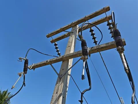 Ow angle view of high voltage electrical drop out fuse cutout. Stock Photos