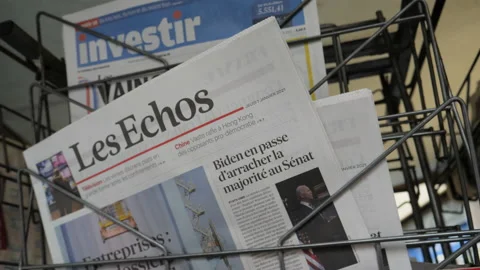 Ow angle view of newspaper kiosk stall with international and French press Stock Footage 146240155