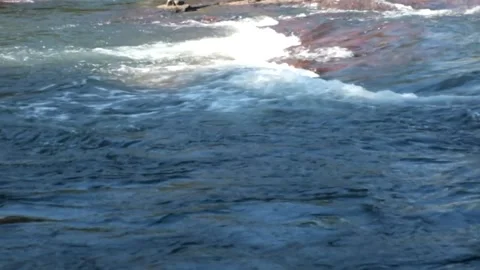 Owerful white water rapids flowing in mountain river Stock Footage 328444566