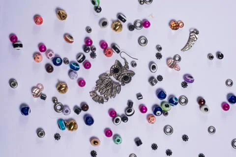 A owl craft and other objects on a white table Foto stock