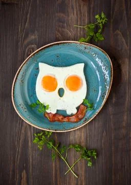 Owl-shaped fried eggs Stock Photos