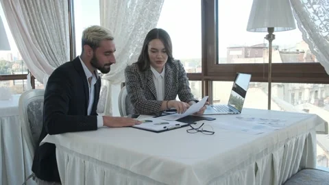 Owner and manager discuss working moments in the restaurant Stock Footage 130915642