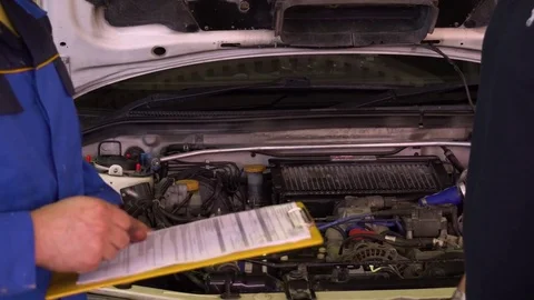 The owner of the car hands over the keys to the mechanic in the garage close-up Stock Footage 75685935