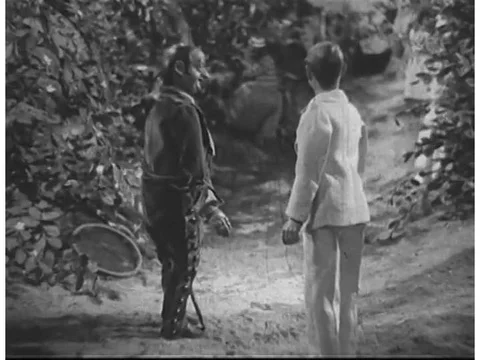 The owner of a coffee plantation, played by a puppet in a 1930s film, tells his Stock Footage 74875692